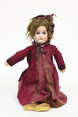 Lot 525 - A bisque head doll with weighted eyes, open...