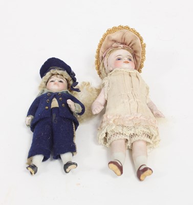 Lot 532 - A sailor boy bisque doll with fixed eyes and...