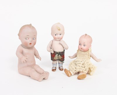 Lot 533 - A 'Googly' bisque doll ornament seated nude...