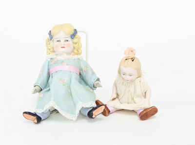 Lot 534 - A German bisque doll with painted eyes and...