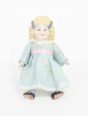 Lot 534 - A German bisque doll with painted eyes and...