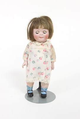 Lot 535 - A 'Googly' bisque doll with weighted eyes and...