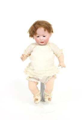 Lot 537 - A German baby bisque doll with weighted eyes,...