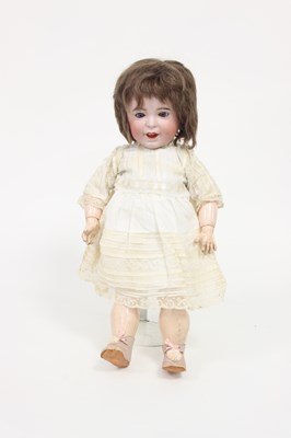 Lot 543 - A French bisque head doll with weighted eyes,...