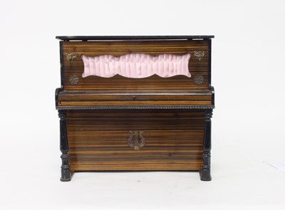 Lot 568 - A doll's simulated rosewood piano with pleated...