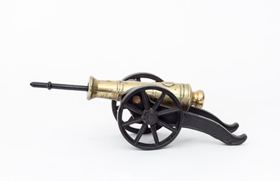 Lot 585 - A brass cannon on an iron carriage, cast with...