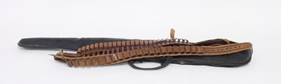 Lot 592 - Three leather cartridge belts and a gun slip