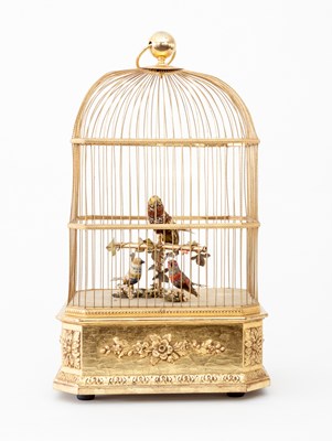 Lot 605 - A 20th Century caged bird musical automaton,...