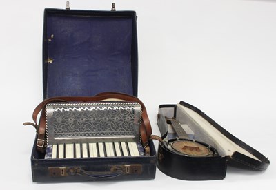 Lot 606 - A ukulele in a case and a piano accordion