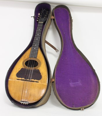 Lot 607 - A mandolin in a case by G Grandini, 72cm long