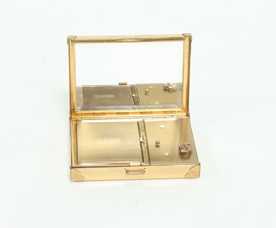 Lot 610 - A Swiss musical compact, the hinged cover...