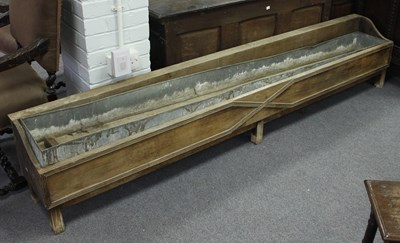 Lot 651 - A large oak feeding trough, with panelled...