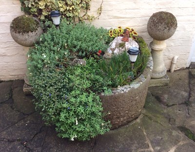 Lot 658 - A large D shaped stone trough, 94cm wide