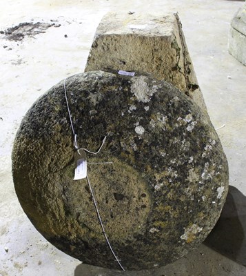 Lot 661 - A staddle stone top on a tapered base, 75cm high