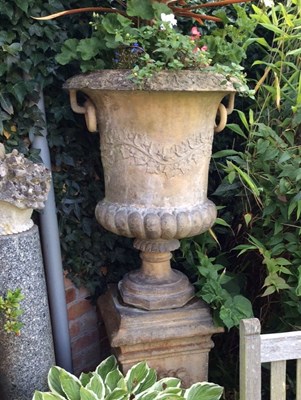 Lot 663 - A Coade stone style campana-shaped two-handled...