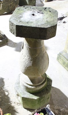 Lot 664 - A stone baluster column on an octagonal base,...