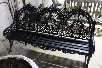 Lot 669 - A garden triple-back bench with slatted seat