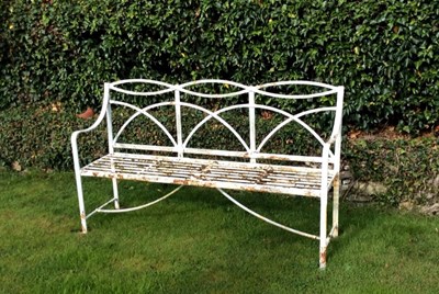 Lot 673 - A Regency wrought iron garden seat with reeded...