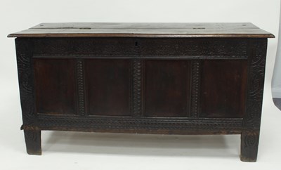 Lot 706 - An 18th Century oak coffer, the hinged lid...