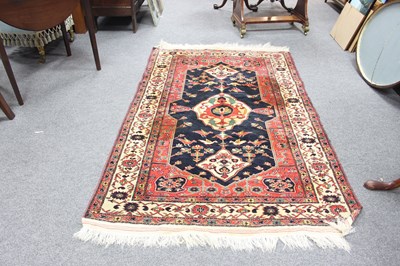 Lot 717 - A Hamadan rug with blue ground central field,...