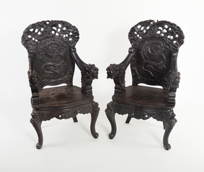 Lot 730 - A pair of carved Oriental armchairs with...