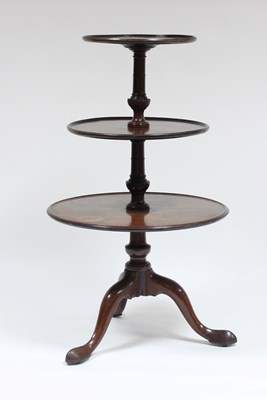 Lot 745 - A George III mahogany three-tier dumb waiter,...