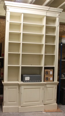 Lot 754 - A very large library bookcase, cream painted...