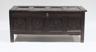 Lot 759 - A 17th Century oak chest, the four-panel top...