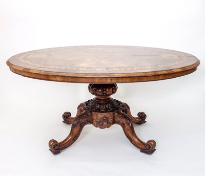 Lot 772 - A Victorian walnut loo table, the oval top...