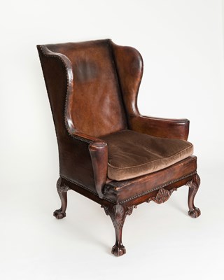 Lot 813 - A George II style mahogany wing armchair...