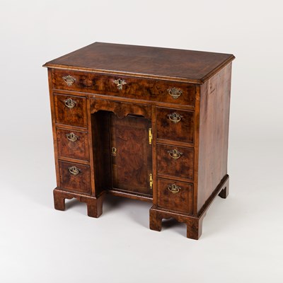 Lot 815 - A George II walnut kneehole desk, the cross...