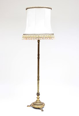 Lot 817 - A brass standard lamp, the ribbon-tied reeded...