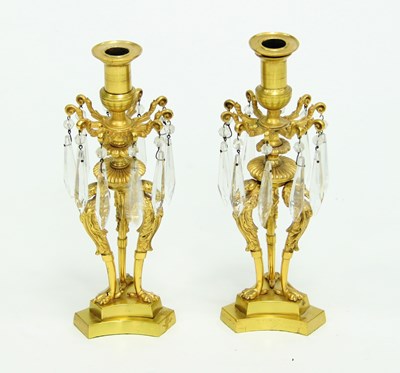 Lot 825 - A pair of gilt brass lustre candlesticks on...