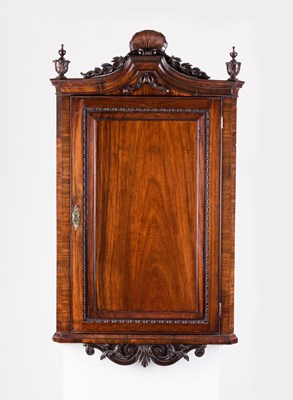 Lot 830 - A George II padouk hanging corner cupboard,...