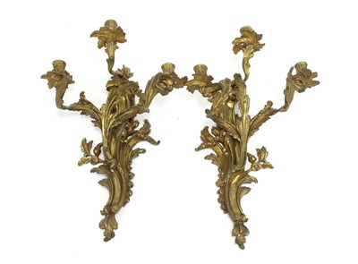 Lot 831 - A pair of rococo style three-branch gilt metal...