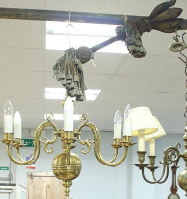 Lot 832 - A Dutch brass six-light chandelier with scroll...