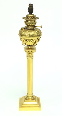 Lot 841 - A brass Corinthian column oil lamp with...