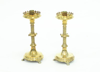 Lot 854 - A pair of gothic revival altar candlesticks in...