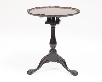 Lot 856 - A George III mahogany piecrust tripod table...