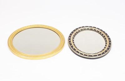 Lot 858 - An oval mirror in parcel gilt and glass bead...