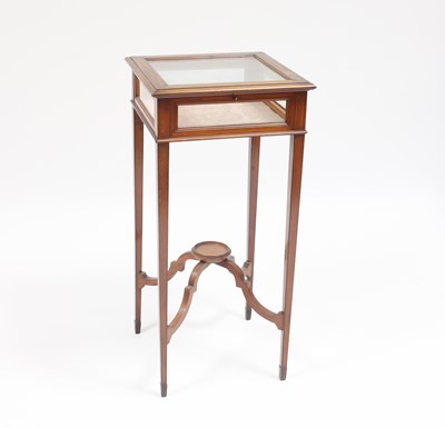 Lot 860 - An Edwardian satinwood square-topped table...