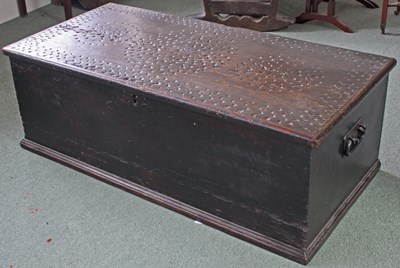 Lot 869 - A carved stained pine box with iron carrying...