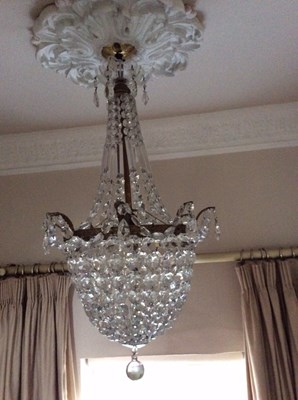 Lot 876 - A cut glass chandelier hung prismatic drops...