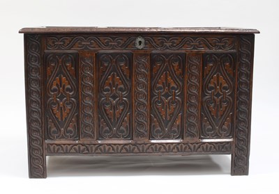 Lot 882 - An 18th Century oak chest with triple panelled...