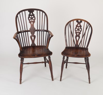 Lot 883 - Twelve ash and elm wheel back Windsor chairs...