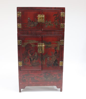 Lot 889 - A Chinese red lacquer cabinet enclosed by two...