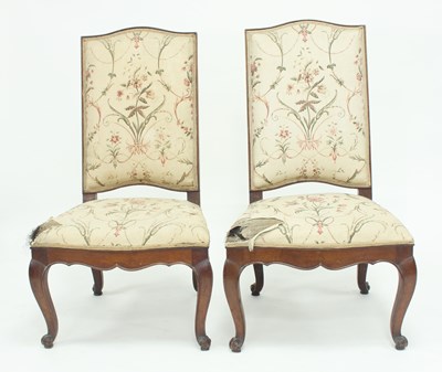 Lot 917 - A pair of Louis XV walnut side chairs, with...