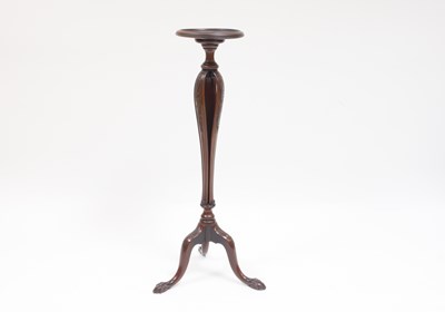 Lot 926 - A mahogany torchere with triple carved slatted...