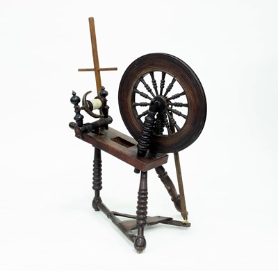 Lot 946 - A spinning wheel, with turned supports, 90cm high