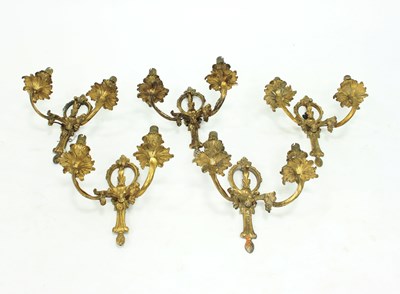 Lot 947 - A set of five French ormolu two-branch wall...